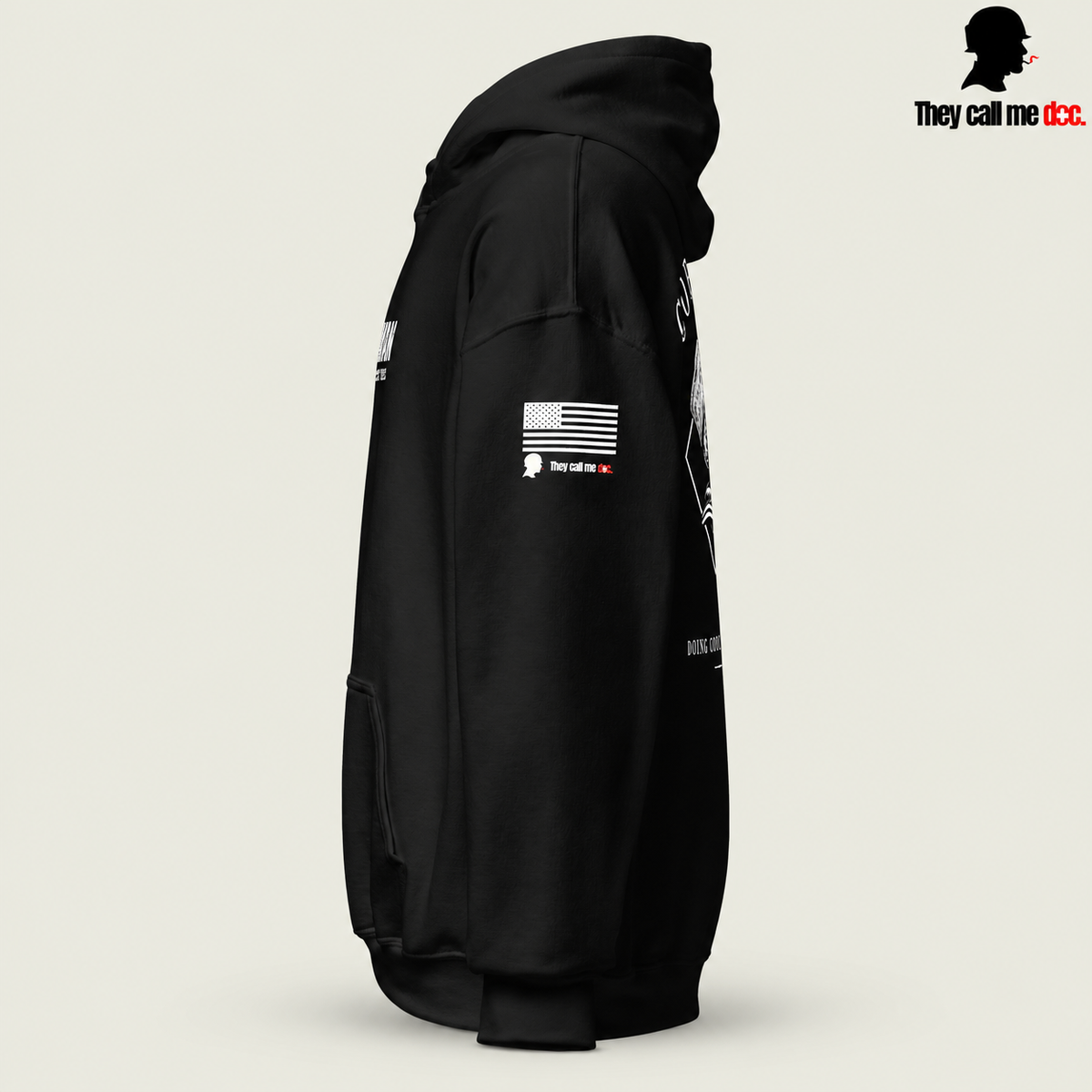 Corpsman 8404 Hoodie in black — left sleeve view with American flag and They Call Me Doc logo