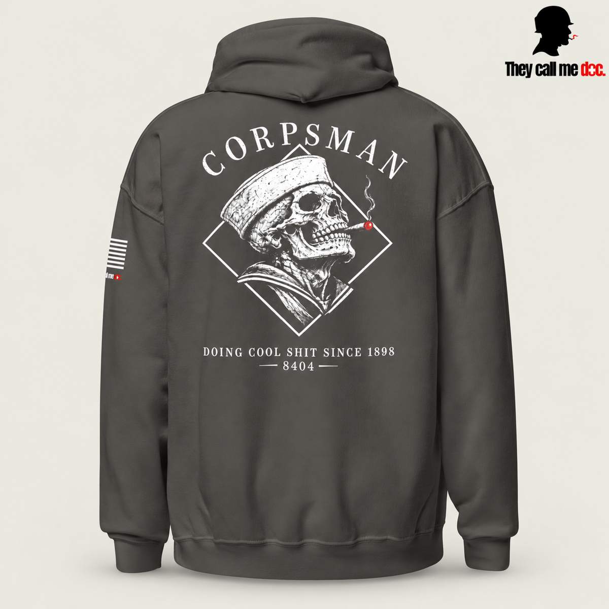 Corpsman 8404 Hoodie in charcoal — back view with cigar-smoking skull and Doing Cool Shit Since 1898 graphic
