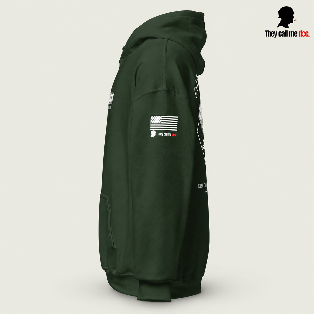 Corpsman 8404 Hoodie in forest green — left sleeve view with American flag and They Call Me Doc logo