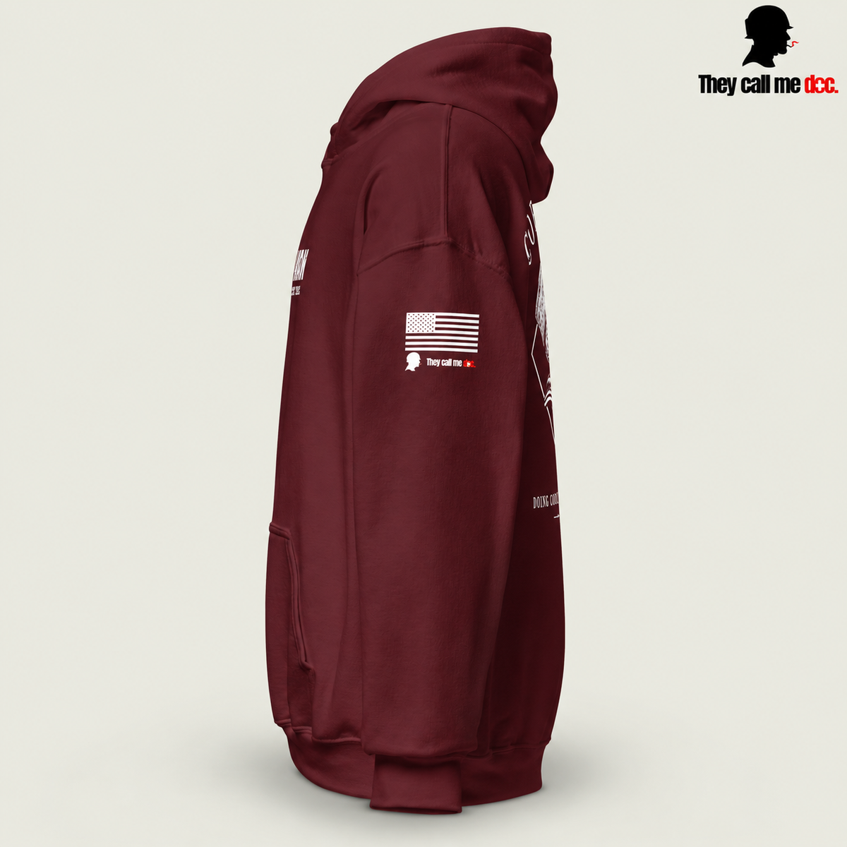 Corpsman 8404 Hoodie in maroon — left sleeve view with American flag and They Call Me Doc logo